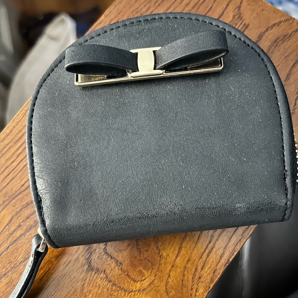 Adorable coin purse with decorative bow.  New. Never used.